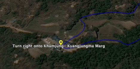 Turn right onto Khumjung - Kyangjugma Marg. and continue on for 1.0 km. (.62 mi.).
